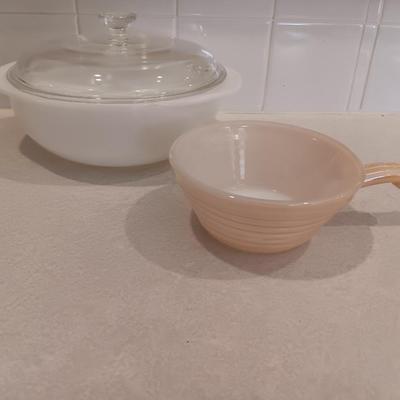White pyrex bowl with glass lid and an orage luster Fireking handled soup bowl