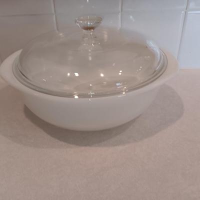 White pyrex bowl with glass lid and an orage luster Fireking handled soup bowl