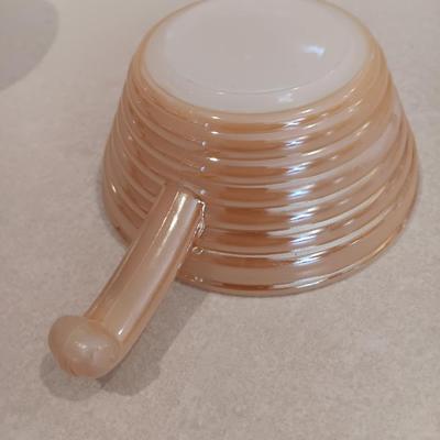White pyrex bowl with glass lid and an orage luster Fireking handled soup bowl