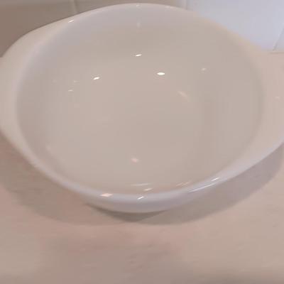 White pyrex bowl with glass lid and an orage luster Fireking handled soup bowl