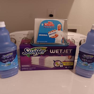 New Swiffer wetjet cleaner and pads and a partial box of Mr. clean magic erasers