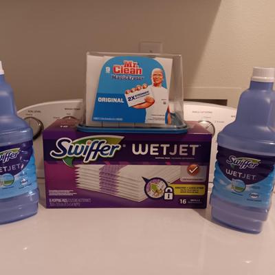 New Swiffer wetjet cleaner and pads and a partial box of Mr. clean magic erasers
