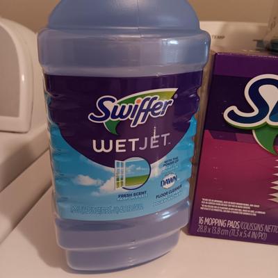 New Swiffer wetjet cleaner and pads and a partial box of Mr. clean magic erasers