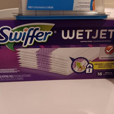 New Swiffer wetjet cleaner and pads and a partial box of Mr. clean magic erasers