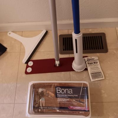 Bona mop with partial box of Bona wipes for hardwood floors and a super mop