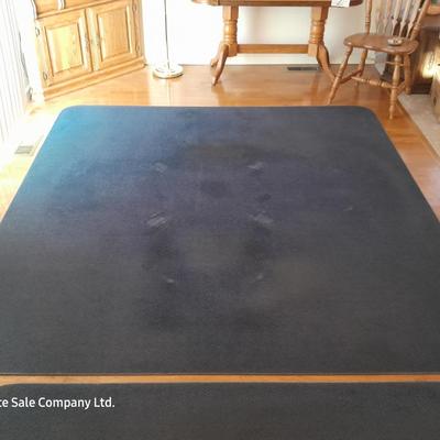 Large blue area rug with matching runner and a floral kitchen rug