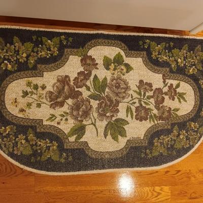 Large blue area rug with matching runner and a floral kitchen rug