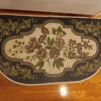 Large blue area rug with matching runner and a floral kitchen rug