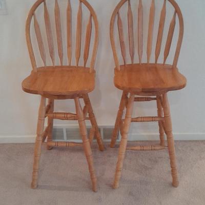 Two nice oak high back swivel bar stools