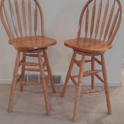 Two nice oak high back swivel bar stools