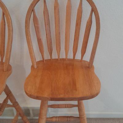 Two nice oak high back swivel bar stools