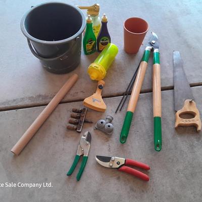 Variety of Garden hand tools - Clippers - lopers - saw - sprinkler heads and more