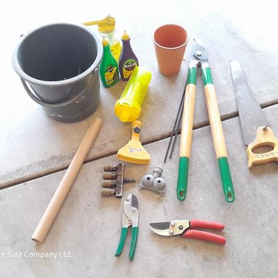 Variety of Garden hand tools - Clippers - lopers - saw - sprinkler heads and more