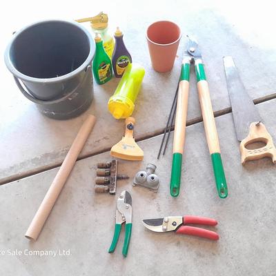 Variety of Garden hand tools - Clippers - lopers - saw - sprinkler heads and more