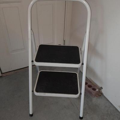 Folding two - step Tricam brand stool and a nice plastic one step stool