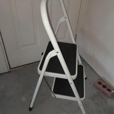 Folding two - step Tricam brand stool and a nice plastic one step stool