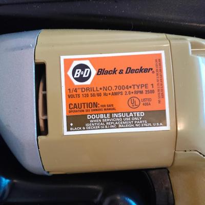 Black and Decker 1/4" electric drill with case and accessories