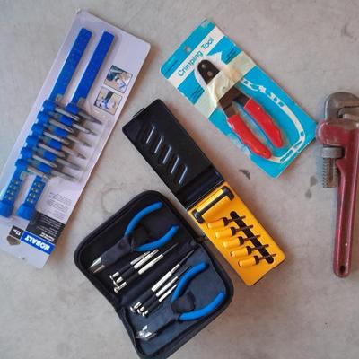 Variety of tools - pipe wrench - drill bits - pliers set in storage bag and more