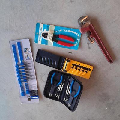 Variety of tools - pipe wrench - drill bits - pliers set in storage bag and more