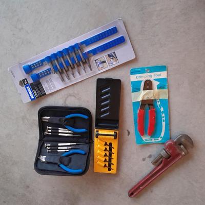 Variety of tools - pipe wrench - drill bits - pliers set in storage bag and more