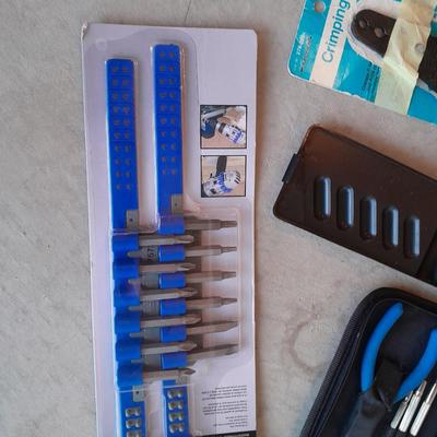 Variety of tools - pipe wrench - drill bits - pliers set in storage bag and more