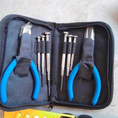 Variety of tools - pipe wrench - drill bits - pliers set in storage bag and more