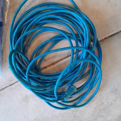 Two blue extension cords and a brand new 5x7 tarp