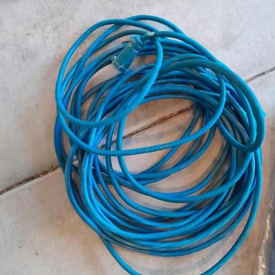 Two blue extension cords and a brand new 5x7 tarp