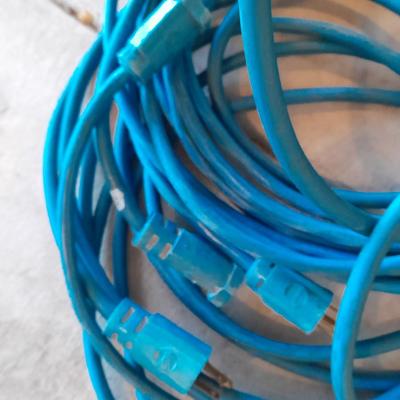 Two blue extension cords and a brand new 5x7 tarp