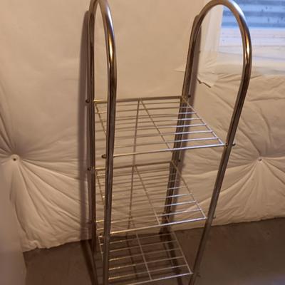 Two shelf metal storage shelf / towel rack with wicker framed mirror