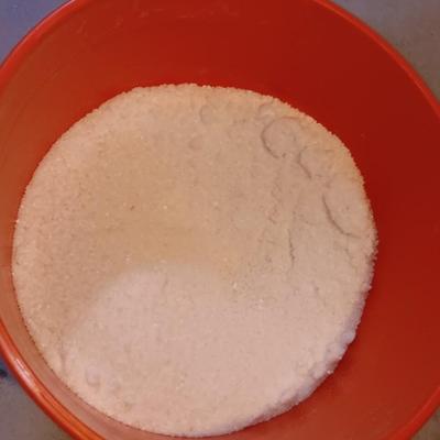 Snow shovel with about half a bucket of salt