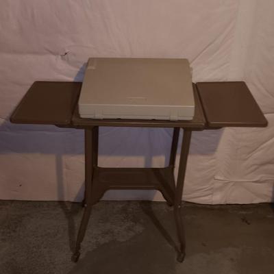 Smith Corona XL1500 electric typewriter on vintage metal typewriter stand.