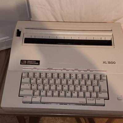 Smith Corona XL1500 electric typewriter on vintage metal typewriter stand.