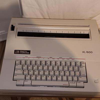 Smith Corona XL1500 electric typewriter on vintage metal typewriter stand.