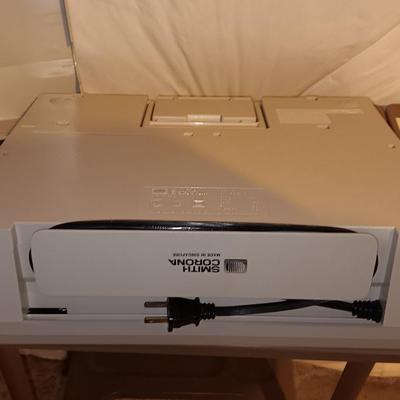 Smith Corona XL1500 electric typewriter on vintage metal typewriter stand.
