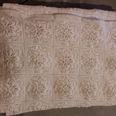 Hand knitted bed spread. square floral pattern