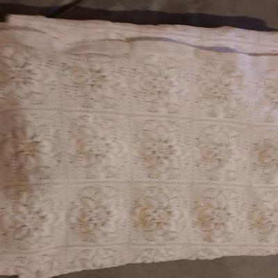 Hand knitted bed spread. square floral pattern