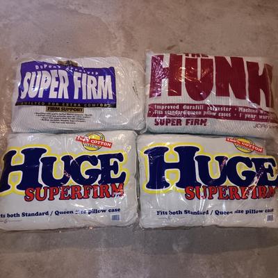 Four pillows that appear new