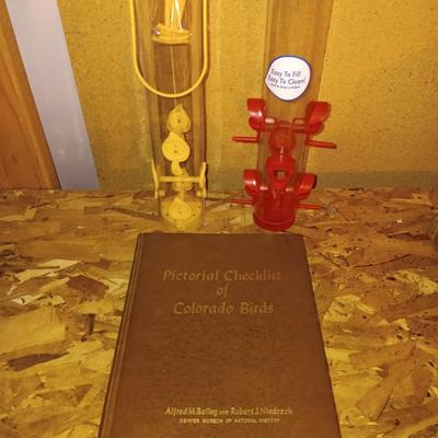 Hardback Pictural checklist of Colorado Birds Alfred M. Balley with two bird feeders