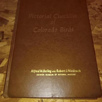 Hardback Pictural checklist of Colorado Birds Alfred M. Balley with two bird feeders