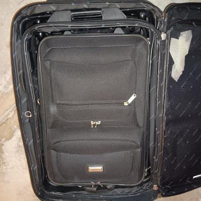 Nice nesting 3-piece PROTOCOL suitcase set with pull along handles - 3 different sizes.