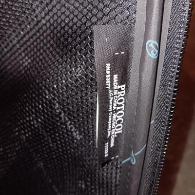 Nice nesting 3-piece PROTOCOL suitcase set with pull along handles - 3 different sizes.