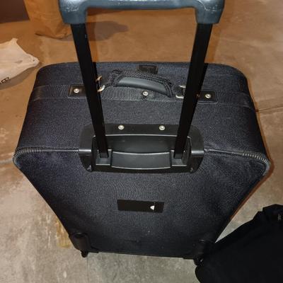 Nice nesting 3-piece PROTOCOL suitcase set with pull along handles - 3 different sizes.