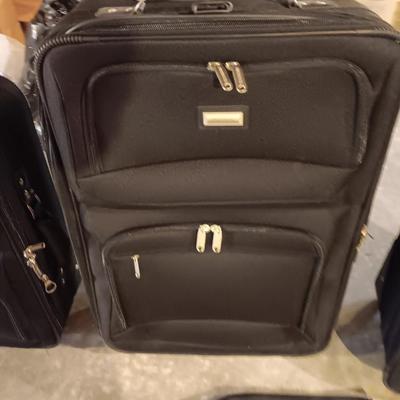 Nice nesting 3-piece PROTOCOL suitcase set with pull along handles - 3 different sizes.