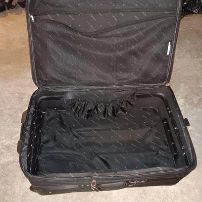 Nice nesting 3-piece PROTOCOL suitcase set with pull along handles - 3 different sizes.