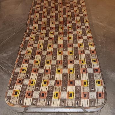 Folding easy store metal framed rollaway bed.