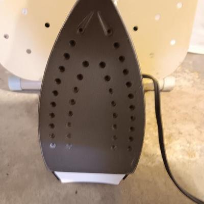 Metal folding ironing board with black& decker clothes iron and clothes pin bag