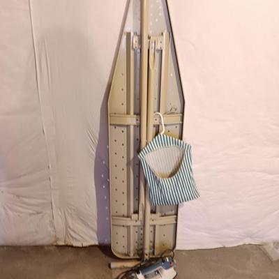 Metal folding ironing board with black& decker clothes iron and clothes pin bag