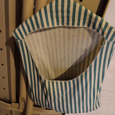 Metal folding ironing board with black& decker clothes iron and clothes pin bag