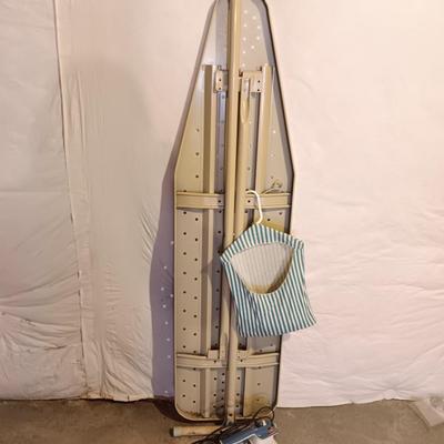 Metal folding ironing board with black& decker clothes iron and clothes pin bag